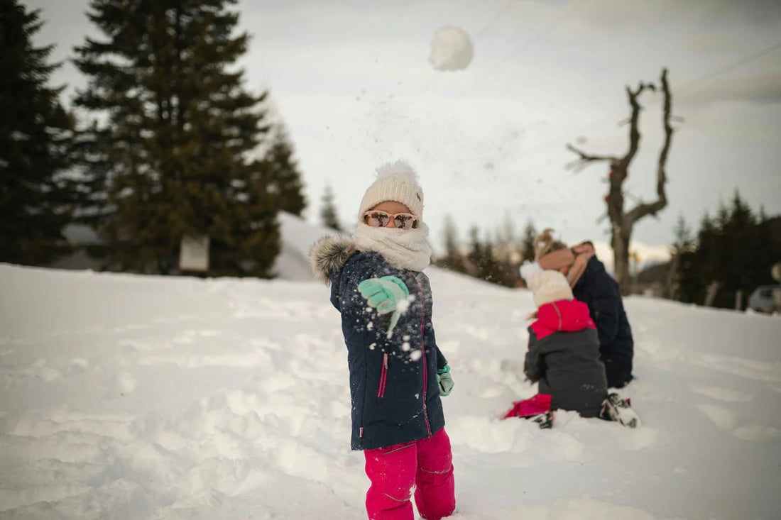 girl throwing a snowball