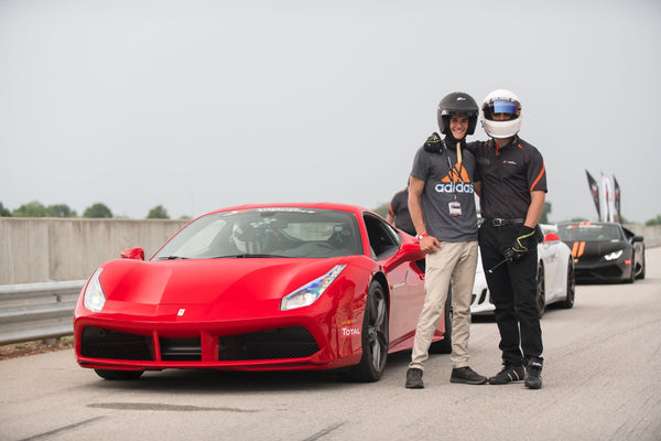 2 men with red ferrari.jpg