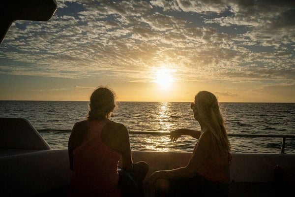 COMBO- Sunset and Manta Ray Snorkel - couple on boat.jpeg