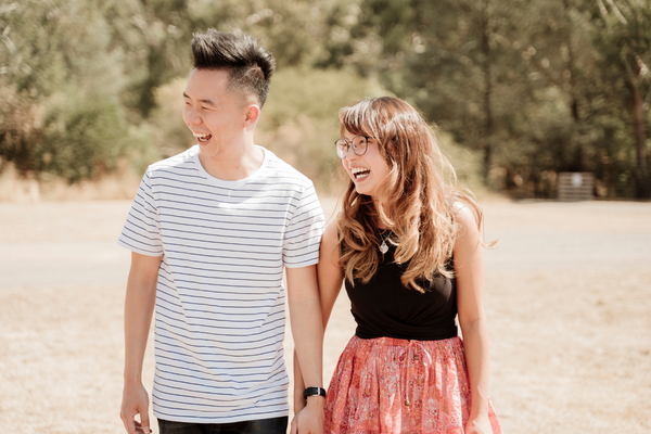 Couple holding hands and laughing