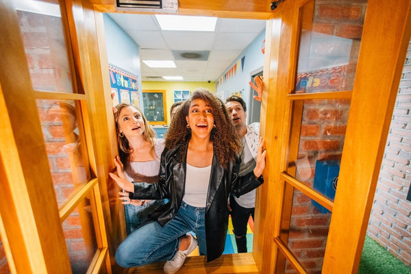 Girl looking through window in escape room