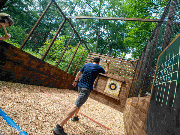 Woman throwing axe