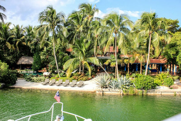 yacht with paddle boards