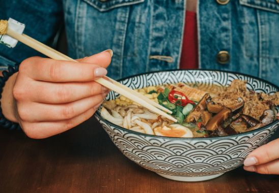 Person eating rame