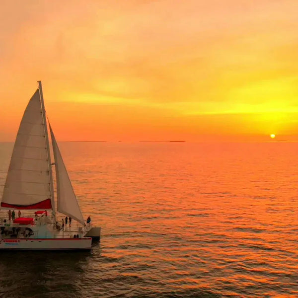 Sunset Sip & Sail boat at sunset.webp