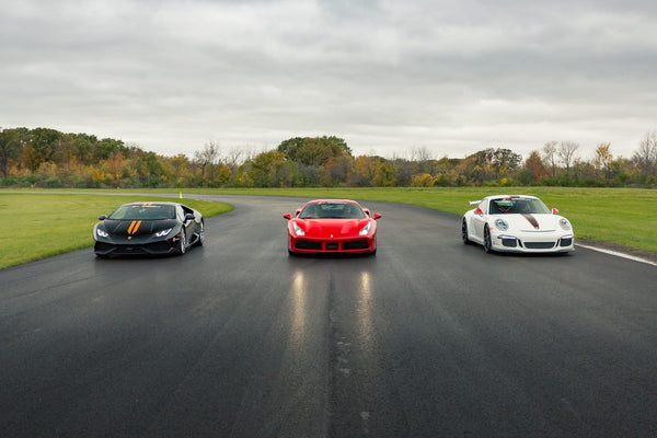 Supercars and signs at track