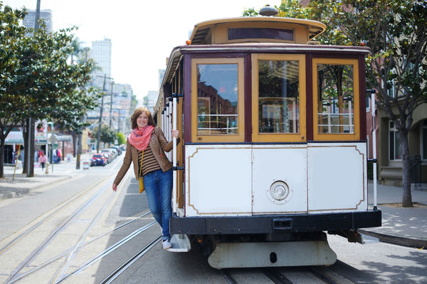 Woman holding onto trolley