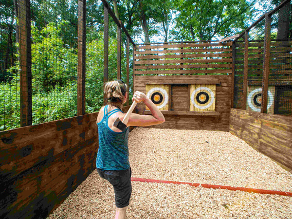 Woman throwing axe