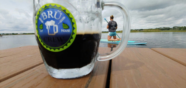 beer and paddle boarder.jpeg