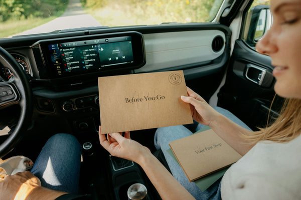 envelopes in womans hand containing clues