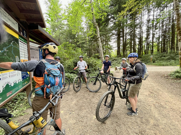 group of bikers on trail