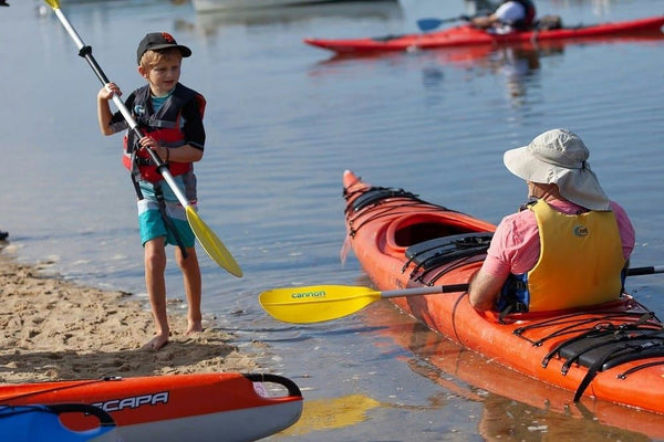 boy on shore with kayak.jpeg