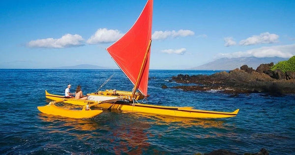 girls with canoe on beach.jpg