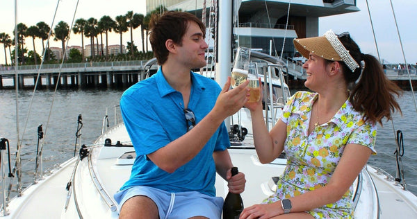 girls with champagne on boat.webp