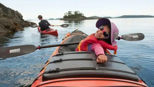 boy on shore with kayak.jpeg