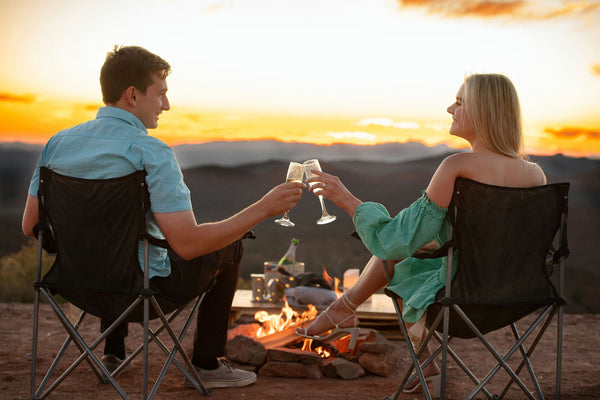 couple sheersing at sunset