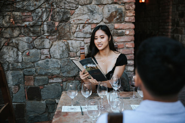 couple with wine glasses in castle