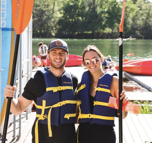 couple with paddles