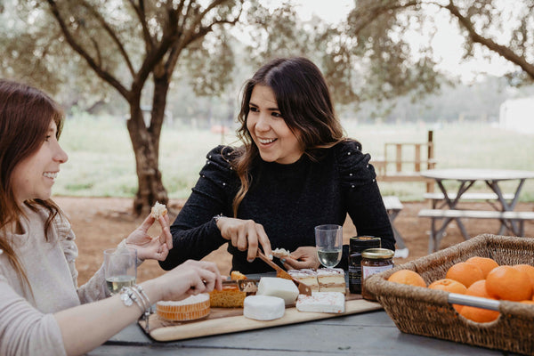 cutting cheese at picnic