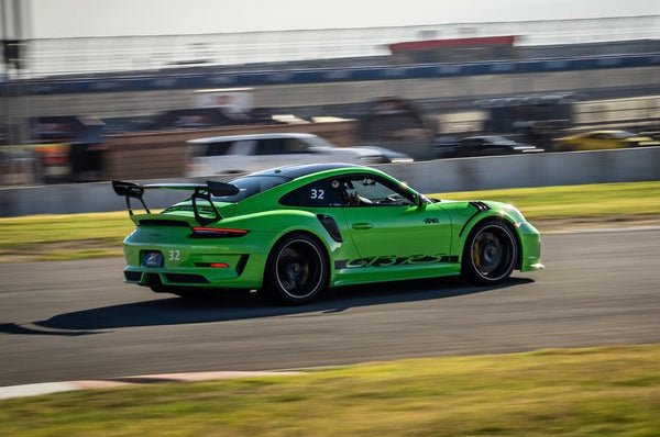 lime green porsche from back