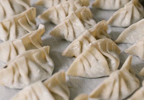 hand stuffing dumplings