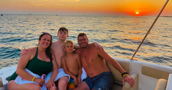 family on boat at sunset.jpeg