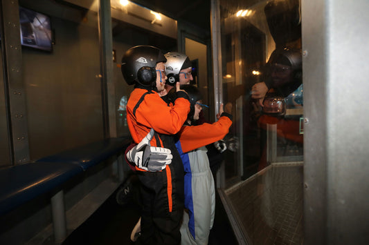 man with thumbs up indoor sky diving