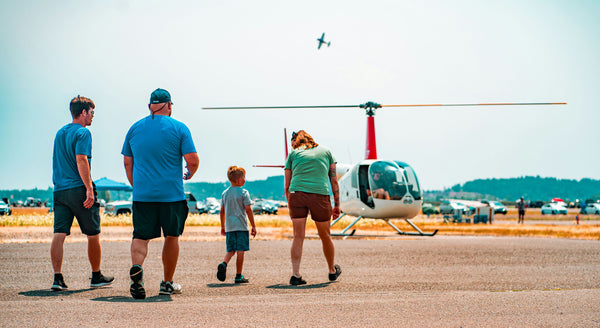 family walking towards helicopter