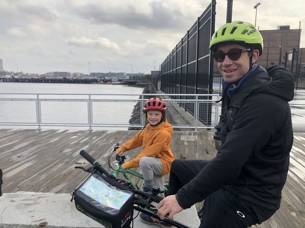 father and daughter on bikes