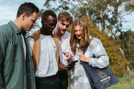 family laughing around picnic spread