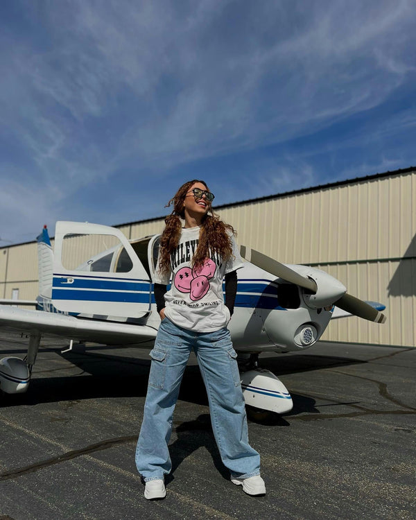 girl in front of plane