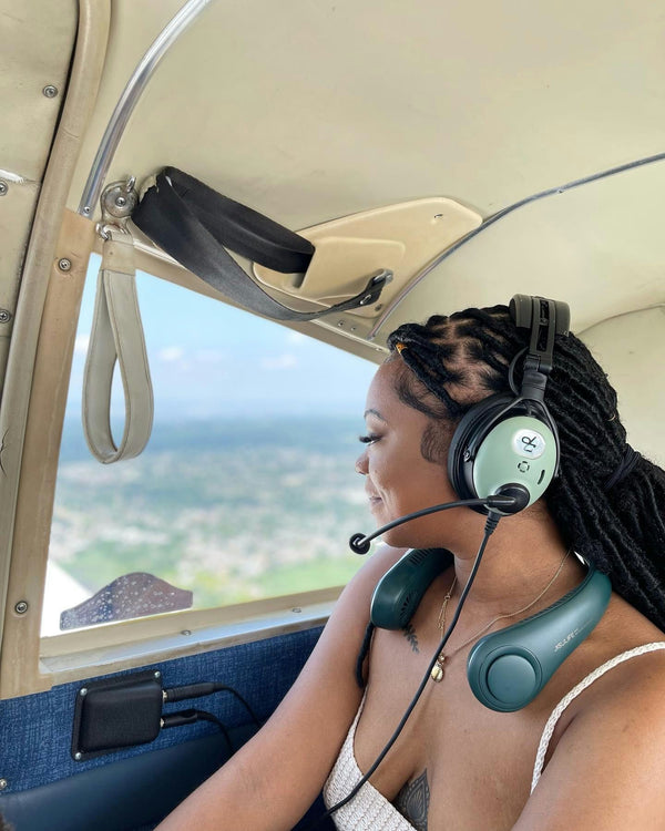 girl in plane looking our window