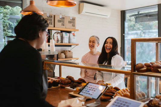 girl in white shirt choosing pastries