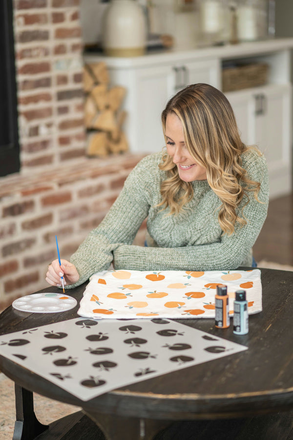 girl painting pillow