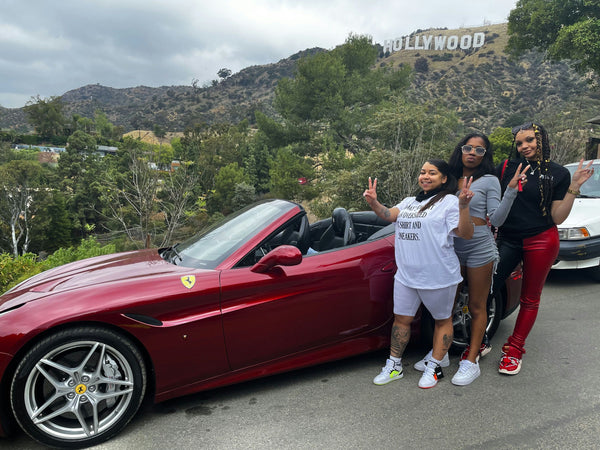 ferrari driving through beverly hills