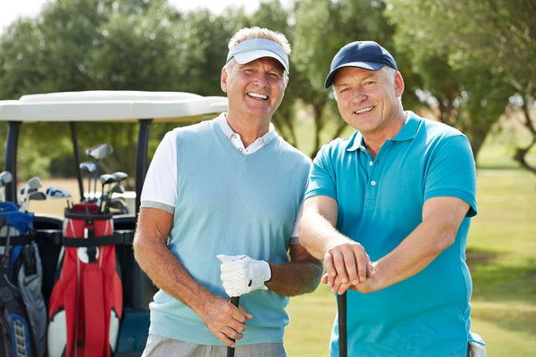 golfers smiling with golf cart