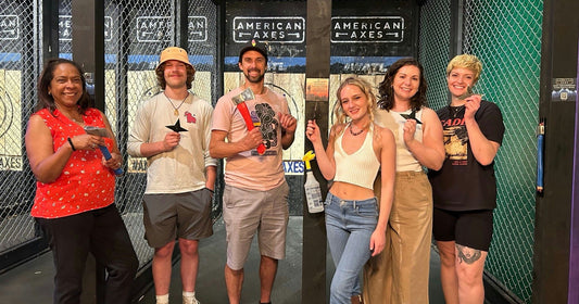 large group at axe throwing place