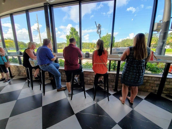 group eating at a bar table