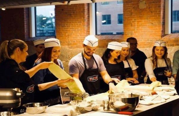 group making pasta