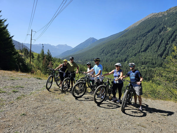 group of bikers in front of tunnel