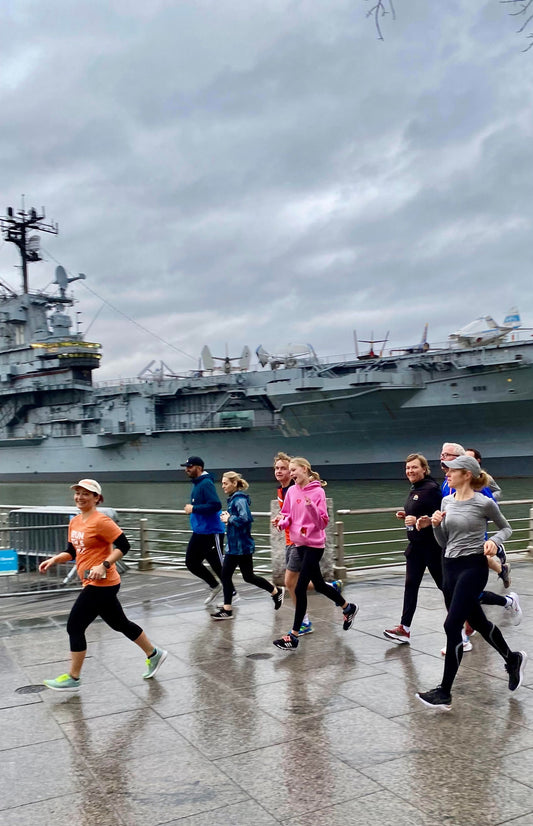 group of runners by a boat.jpg