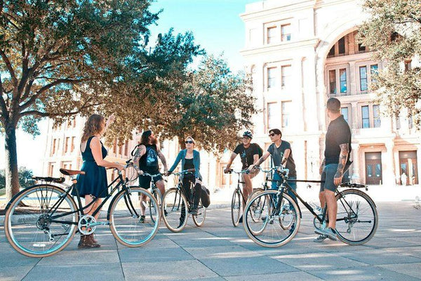 group outside tour stop on bikes