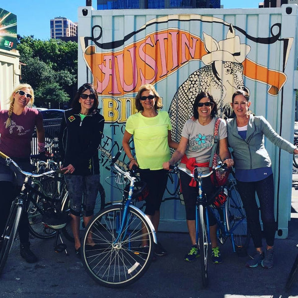 group outside tour stop on bikes