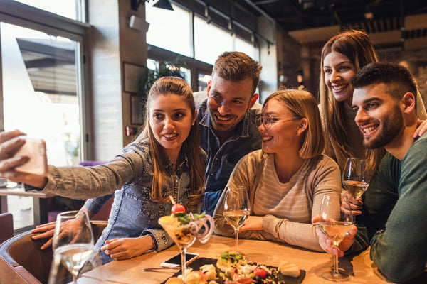 group taking selfie at restaurant.jpeg