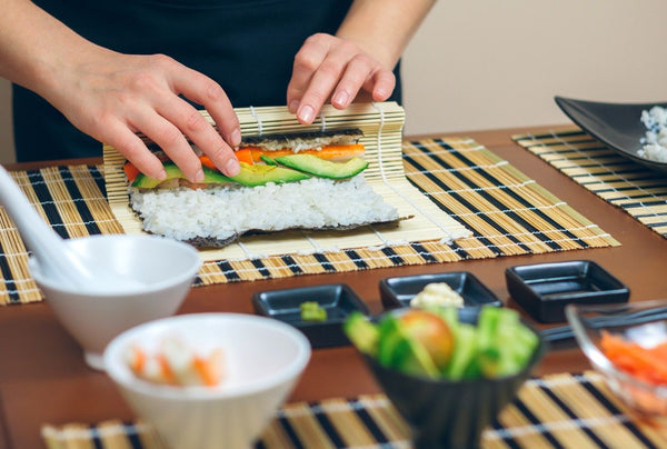 hand rolling sushi