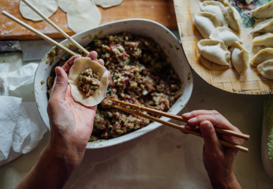 hand stuffing dumplings