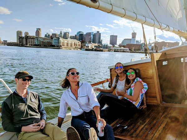 happy group lounging on boat