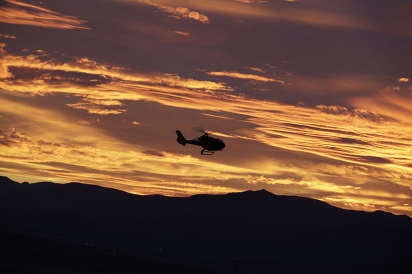 helicopter at sunset