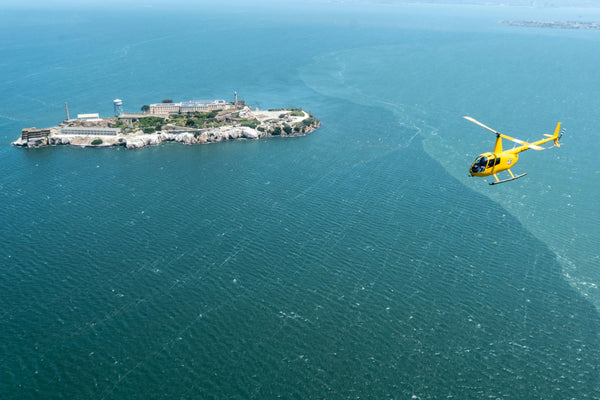 yellow helicopter and golden gate bridge