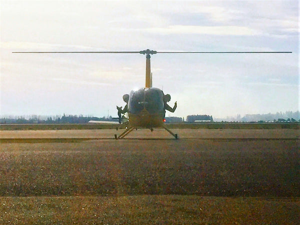 family walking towards helicopter